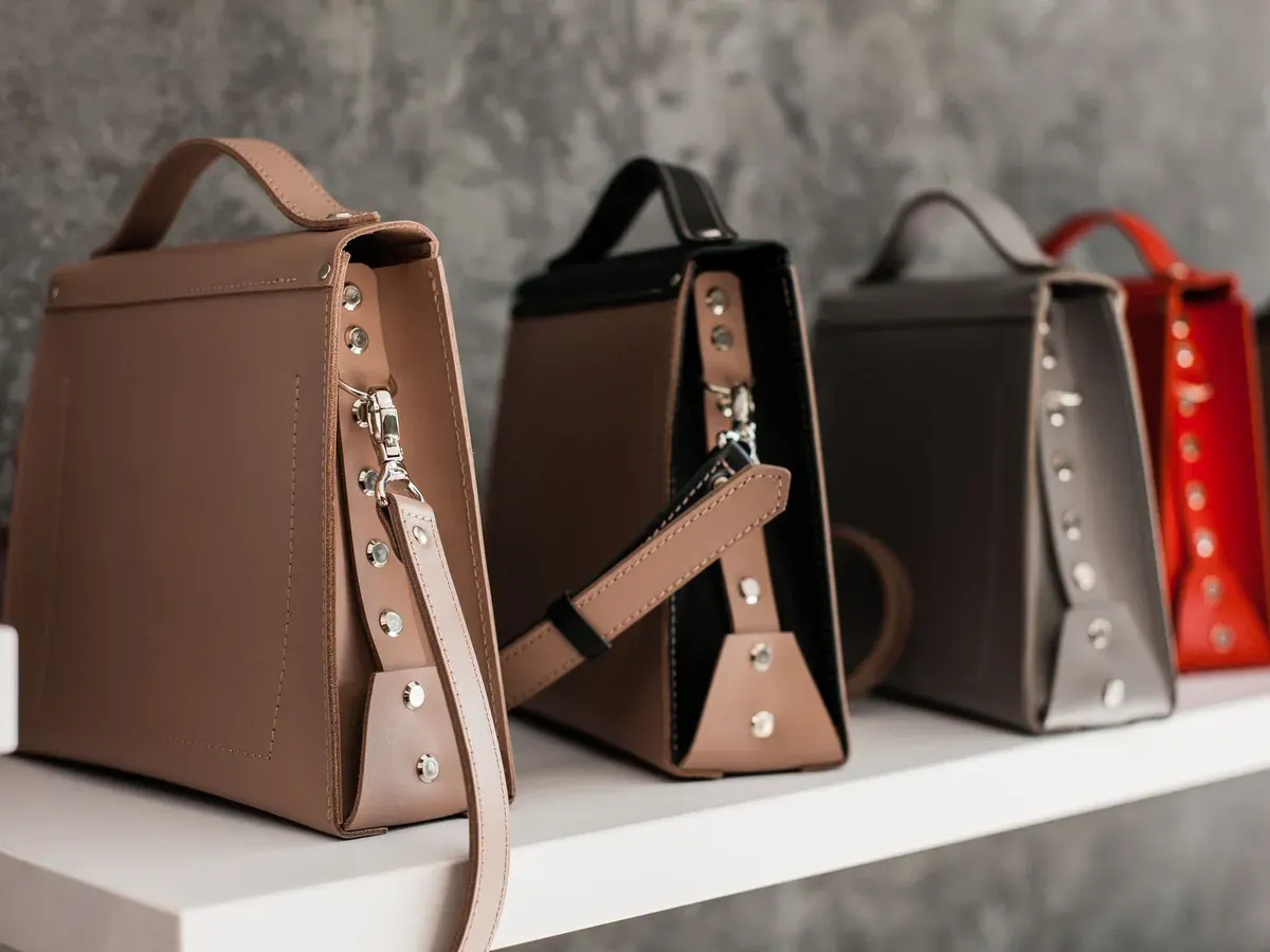 Six pairs of hands, one bag